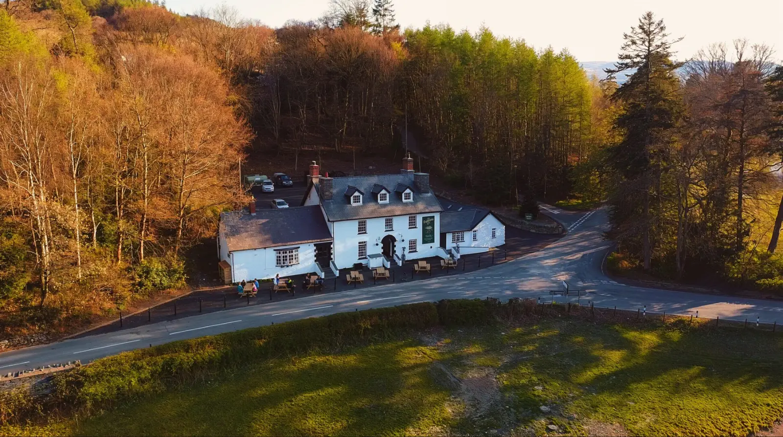 The Bryntirion Inn beside the wooded valley road